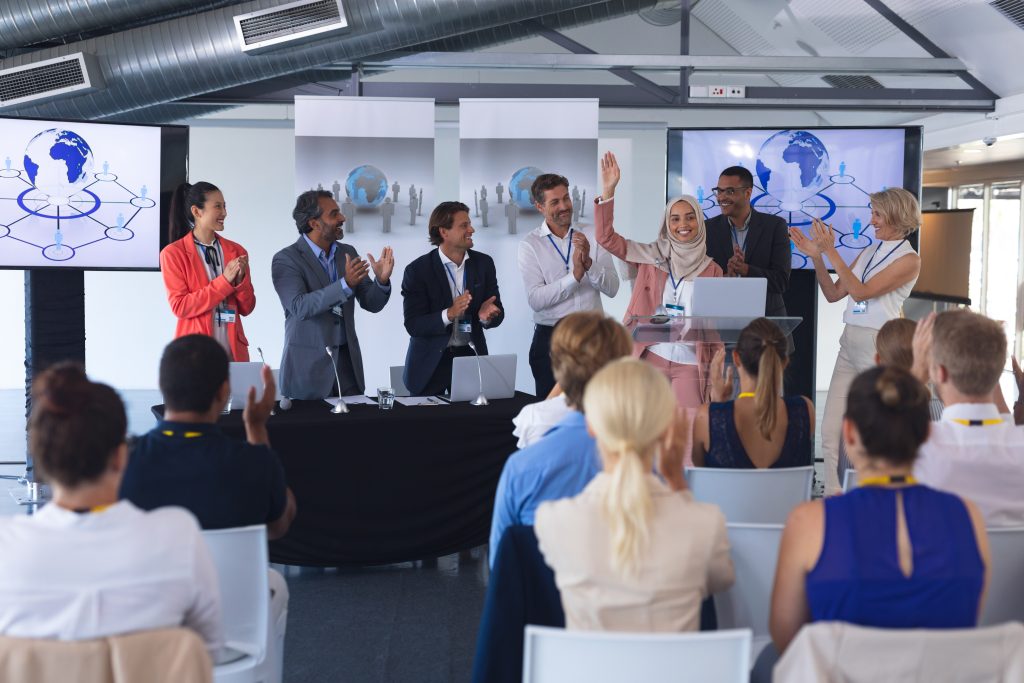 Businesswoman standing with colleagues in a business seminar